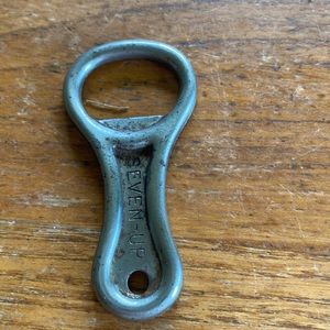 Vintage SEVEN-UP silver tone metal bottle opener with hole for keychain